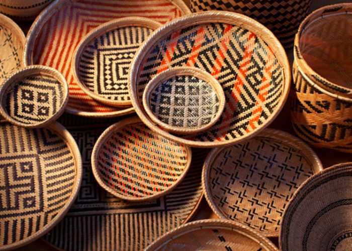 Baskets are handmade and are colored using natural dyes. The designs are ethnic in origin. Handicraft products of Indigenous tribes in Brazil.